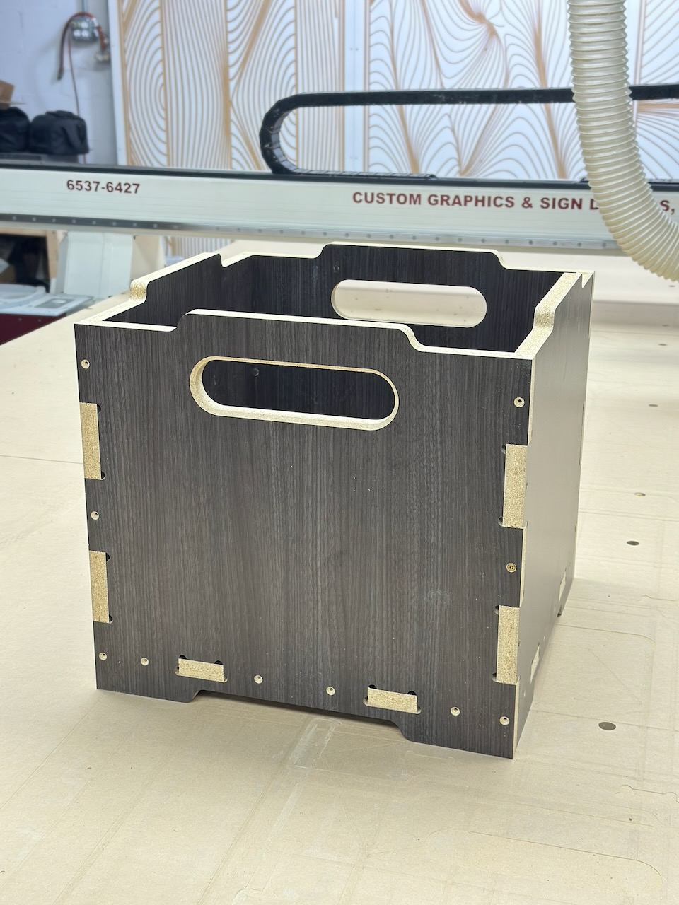 Detail of a CNC-cut storage crate with finger joints