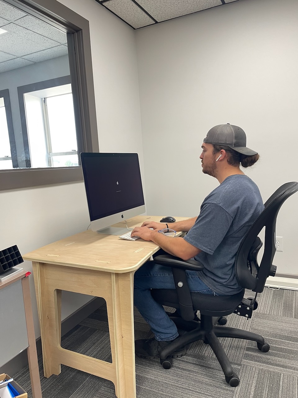 Custom Thole Design plywood desk in daily use