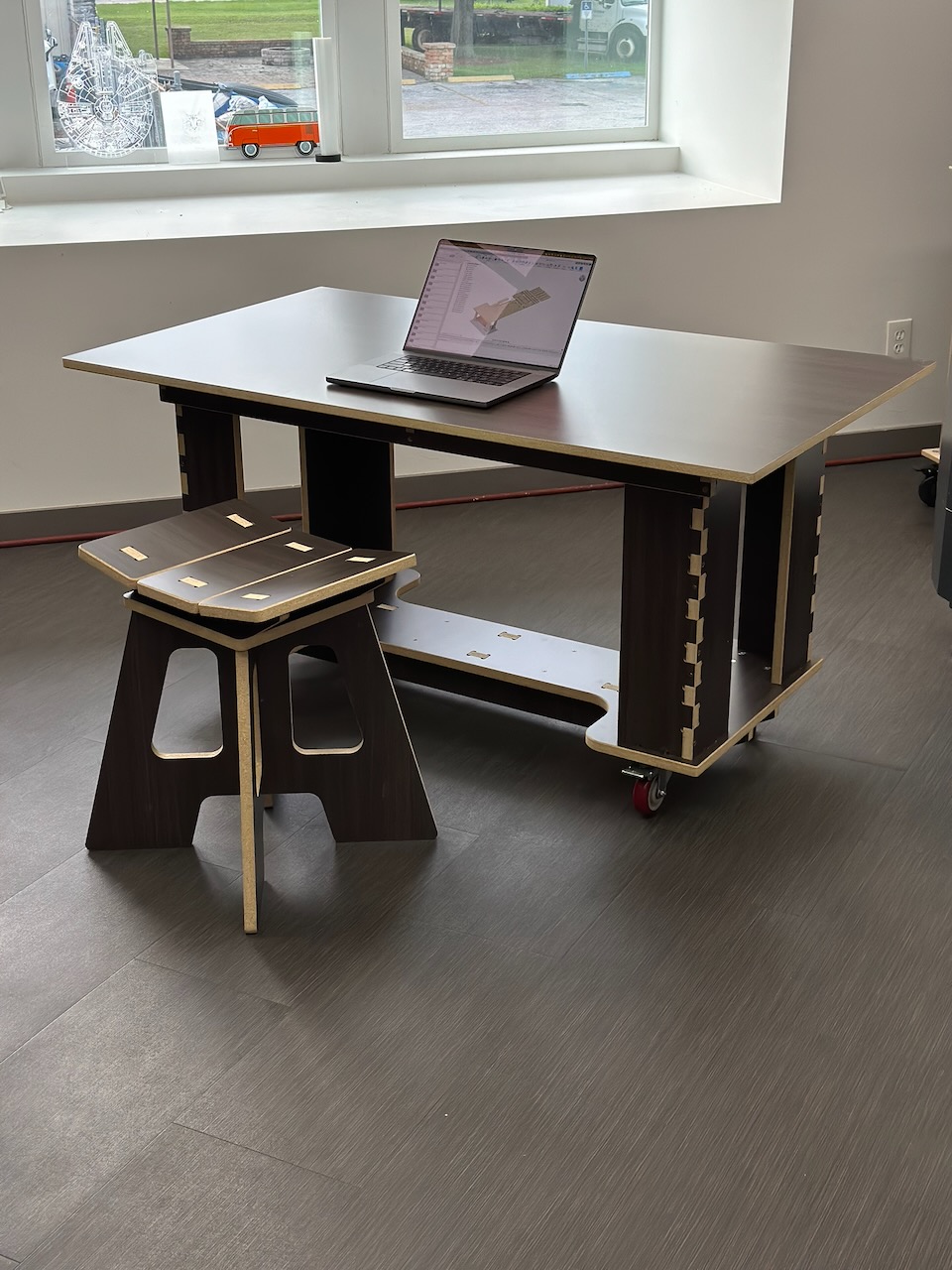Custom dark plywood desk and stool